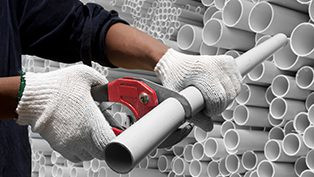 PVC pipes being cut showcasing cost-effectiveness of PVC piping.