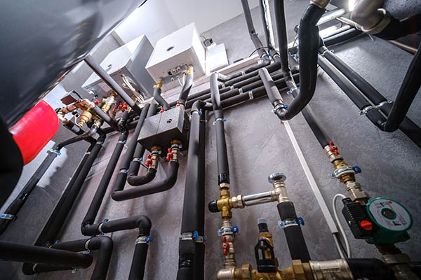 Industrial cast iron ball valves installed on wall