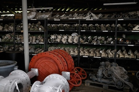 Industrial valves on warehouse shelves